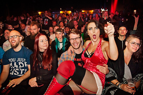 Aya Frick, "the woman your mother warned you for", in the lap of a wrestling fan at Moriskan, Malmö