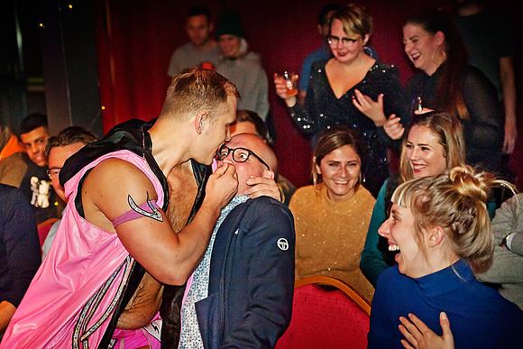 The pin-clad, spray-tanned douchebag Valentine molesting a wrestling fan